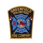 a patch with the fire department symbols and Greenfield Volunteer Fire Company written on it.